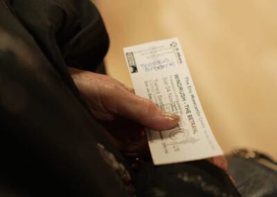 Holding a ticket for the play