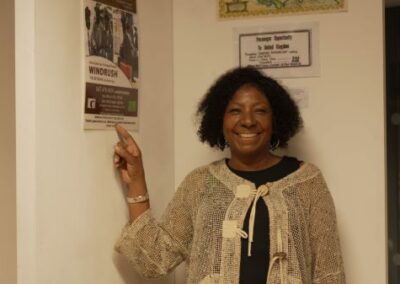 someone pointing to a poster of the play