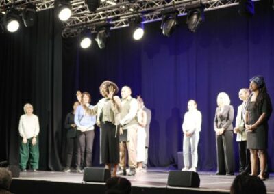 Someone addressing the audience from the stage